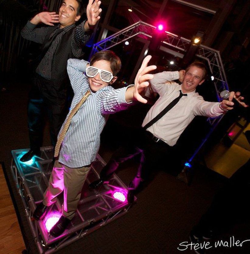 Guests dancing around an interactive dance cube experience